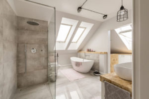 A luxury bathroom with the walk in shower and bathtub